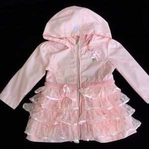 Le Chic baby pink ruffle raincoat.